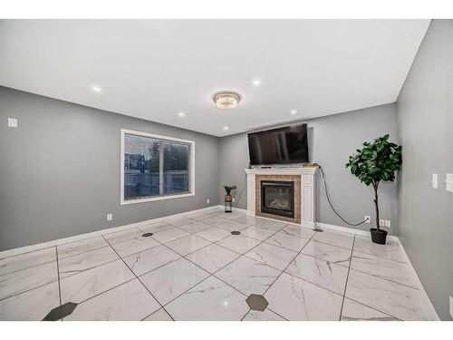 808 Luxstone Square Sw, Airdrie, AB - Indoor With Fireplace