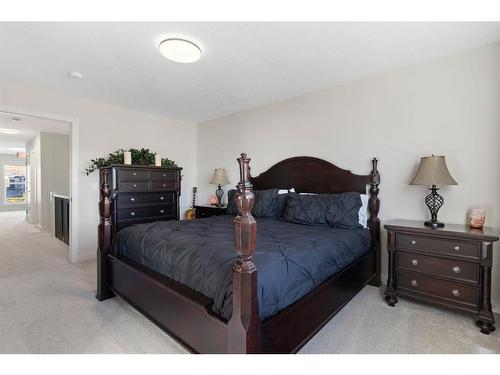 20 Mill Road, Cochrane, AB - Indoor Photo Showing Bedroom