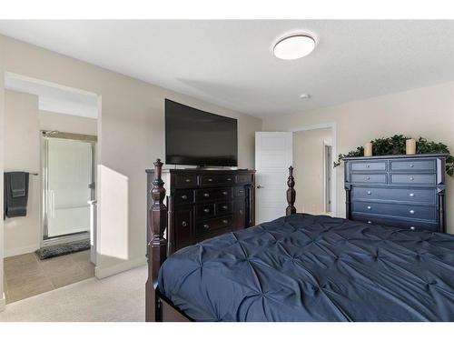 20 Mill Road, Cochrane, AB - Indoor Photo Showing Bedroom