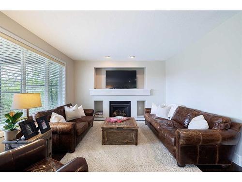 59 Tuscany Glen Place, Calgary, AB - Indoor Photo Showing Living Room With Fireplace