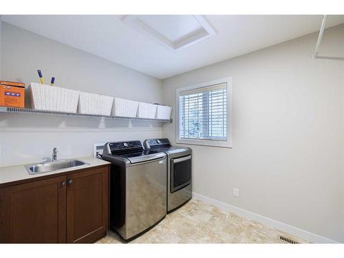 59 Tuscany Glen Place, Calgary, AB - Indoor Photo Showing Laundry Room