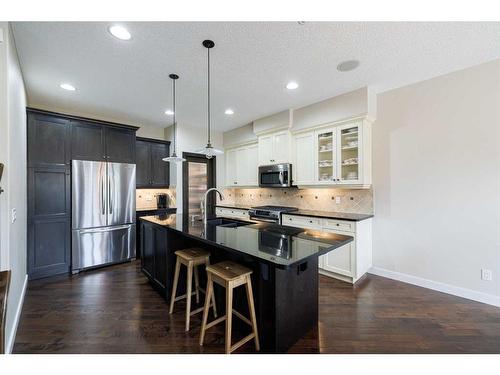 59 Tuscany Glen Place, Calgary, AB - Indoor Photo Showing Kitchen With Stainless Steel Kitchen With Upgraded Kitchen