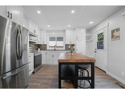 108 Cantrell Drive Sw, Calgary, AB - Indoor Photo Showing Kitchen With Stainless Steel Kitchen