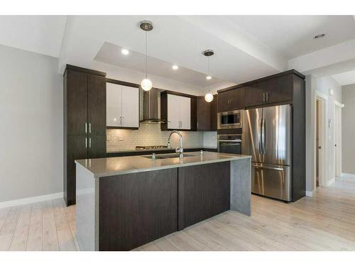 118 Evansmeade Crescent Nw, Calgary, AB - Indoor Photo Showing Kitchen With Stainless Steel Kitchen With Double Sink With Upgraded Kitchen