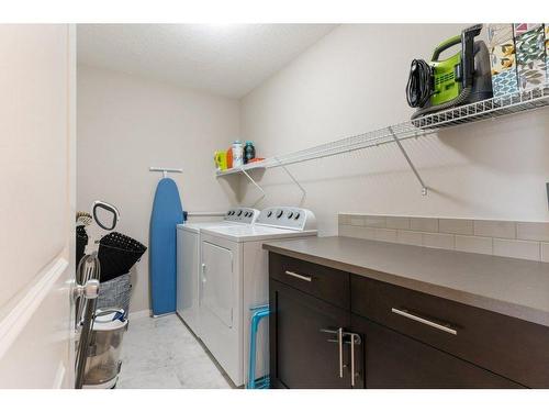 54 Walden Heath Se, Calgary, AB - Indoor Photo Showing Laundry Room