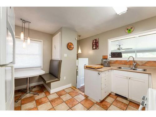 202 27 Avenue Ne, Calgary, AB - Indoor Photo Showing Kitchen With Double Sink