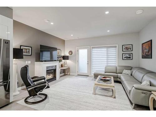 2-2605 15 Street Sw, Calgary, AB - Indoor Photo Showing Living Room With Fireplace