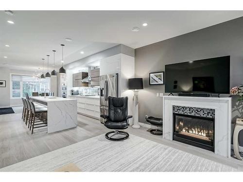 2-2605 15 Street Sw, Calgary, AB - Indoor Photo Showing Living Room With Fireplace