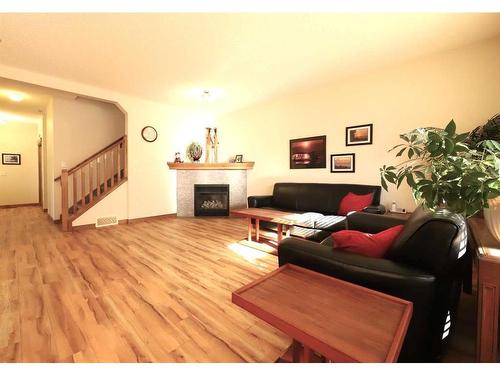 59 Chapalina Close Se, Calgary, AB - Indoor Photo Showing Living Room With Fireplace