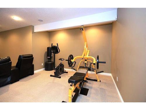 59 Chapalina Close Se, Calgary, AB - Indoor Photo Showing Gym Room