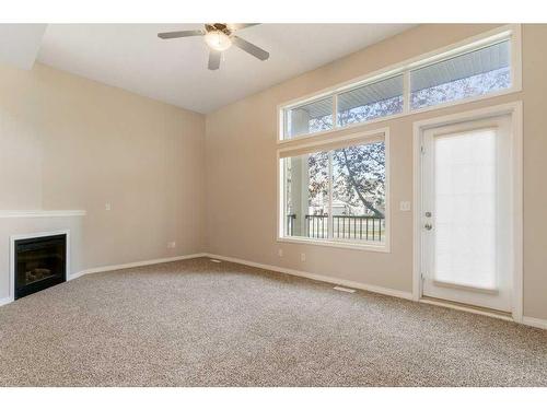 213 Copperfield Boulevard Se, Calgary, AB - Indoor Photo Showing Other Room With Fireplace