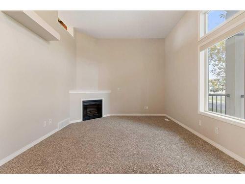 213 Copperfield Boulevard Se, Calgary, AB - Indoor Photo Showing Other Room With Fireplace