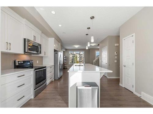 138 New Brighton Walk Se, Calgary, AB - Indoor Photo Showing Kitchen With Upgraded Kitchen