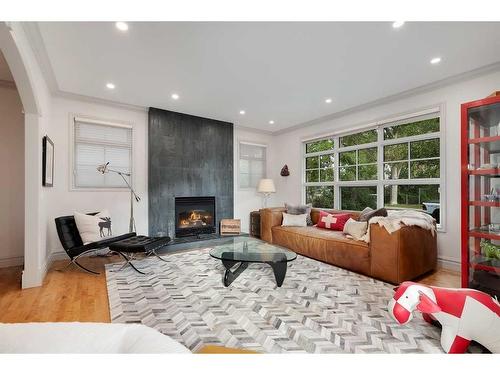 2121 2 Avenue Nw, Calgary, AB - Indoor Photo Showing Living Room With Fireplace