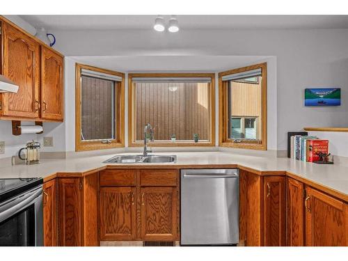 13 Riverview Place, Canmore, AB - Indoor Photo Showing Kitchen With Double Sink