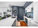 406-2505 17 Avenue, Calgary, AB  - Indoor Photo Showing Kitchen With Double Sink With Upgraded Kitchen 