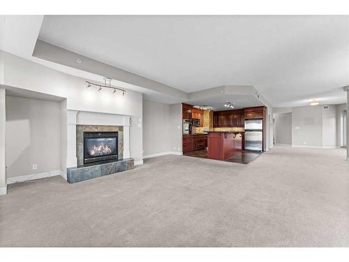 401-110 7 Street Sw, Calgary, AB - Indoor Photo Showing Living Room With Fireplace