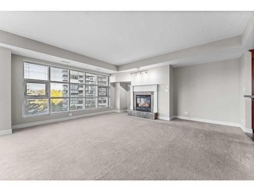 401-110 7 Street Sw, Calgary, AB - Indoor Photo Showing Living Room With Fireplace