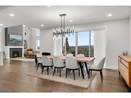 216 Discovery Drive Sw, Calgary, AB - Indoor Photo Showing Dining Room With Fireplace