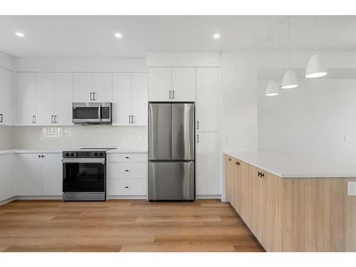 #601-550 Seton Circle Se, Calgary, AB - Indoor Photo Showing Kitchen With Stainless Steel Kitchen