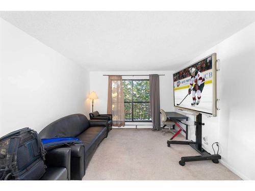 312-1919 36 Street Sw, Calgary, AB - Indoor Photo Showing Gym Room