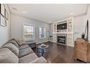 2120 Reunion Square Nw, Airdrie, AB  - Indoor Photo Showing Living Room With Fireplace 