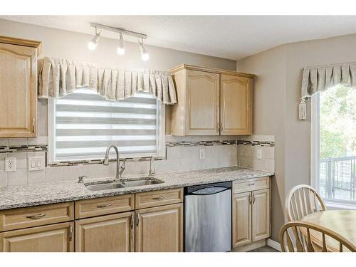 414 Sierra Madre Court Sw, Calgary, AB - Indoor Photo Showing Kitchen With Double Sink