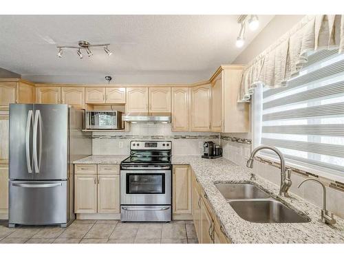 414 Sierra Madre Court Sw, Calgary, AB - Indoor Photo Showing Kitchen With Double Sink