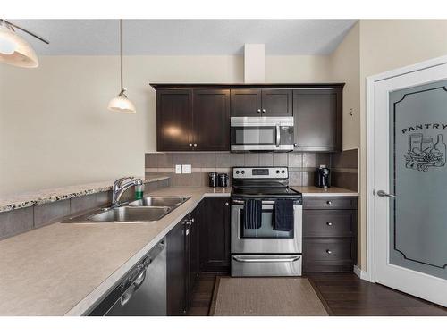 3904-1001 8 Street Nw, Airdrie, AB - Indoor Photo Showing Kitchen With Stainless Steel Kitchen With Double Sink