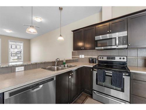 3904-1001 8 Street Nw, Airdrie, AB - Indoor Photo Showing Kitchen With Stainless Steel Kitchen With Double Sink