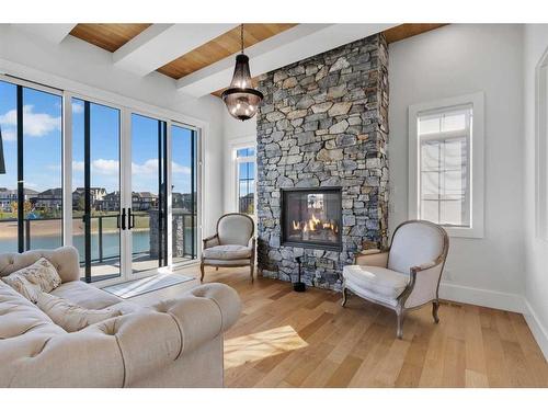 580 Marine Drive Se, Calgary, AB - Indoor Photo Showing Living Room With Fireplace