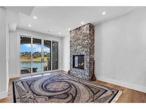 580 Marine Drive Se, Calgary, AB - Indoor Photo Showing Other Room With Fireplace