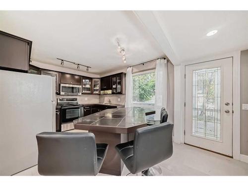 428 Brae Glen Crescent Sw, Calgary, AB - Indoor Photo Showing Dining Room