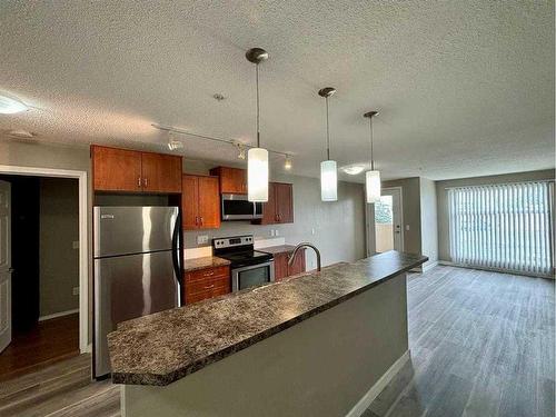 2103-700 Willowbrook Road Nw, Airdrie, AB - Indoor Photo Showing Kitchen With Stainless Steel Kitchen