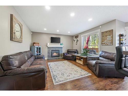 153 West Creek Springs, Chestermere, AB - Indoor Photo Showing Living Room With Fireplace