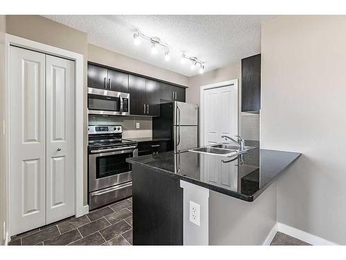 1310-81 Legacy Boulevard Se, Calgary, AB - Indoor Photo Showing Kitchen With Stainless Steel Kitchen With Double Sink With Upgraded Kitchen