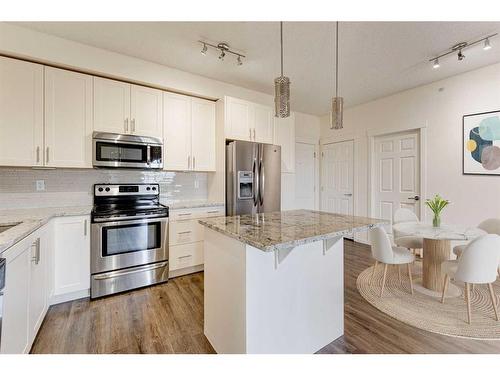 5413-755 Copperpond Boulevard Se, Calgary, AB - Indoor Photo Showing Kitchen With Double Sink With Upgraded Kitchen