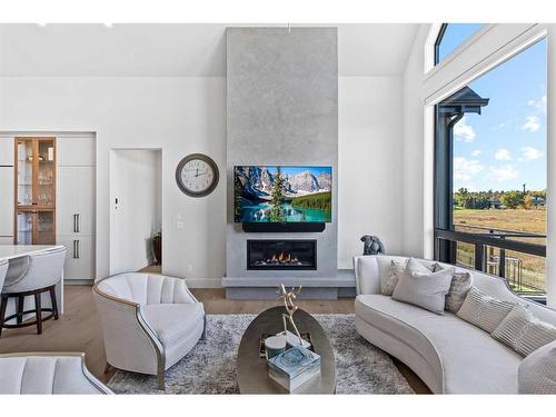 653 Quarry Way Se, Calgary, AB - Indoor Photo Showing Living Room With Fireplace