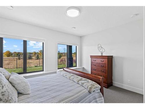 653 Quarry Way Se, Calgary, AB - Indoor Photo Showing Bedroom