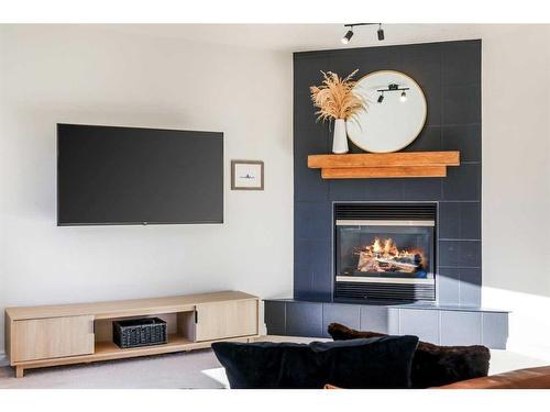 99 Bridleridge Crescent Sw, Calgary, AB - Indoor With Fireplace