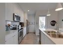 7024 34 Avenue Nw, Calgary, AB  - Indoor Photo Showing Kitchen With Double Sink 