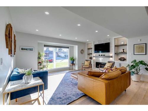 1128 Lake Sylvan Drive Se, Calgary, AB - Indoor Photo Showing Living Room With Fireplace