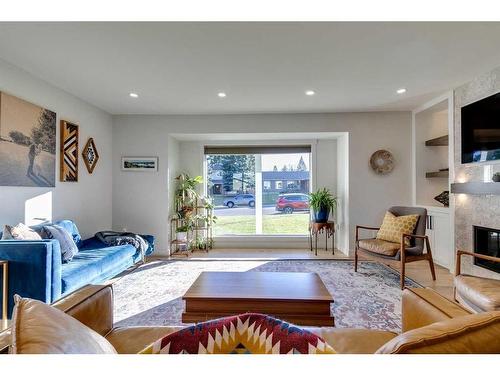 1128 Lake Sylvan Drive Se, Calgary, AB - Indoor Photo Showing Living Room With Fireplace