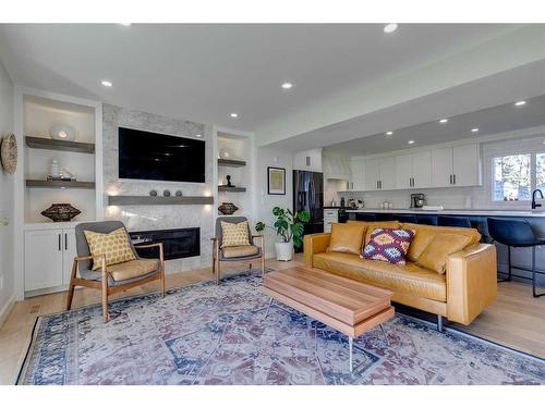 1128 Lake Sylvan Drive Se, Calgary, AB - Indoor Photo Showing Living Room With Fireplace