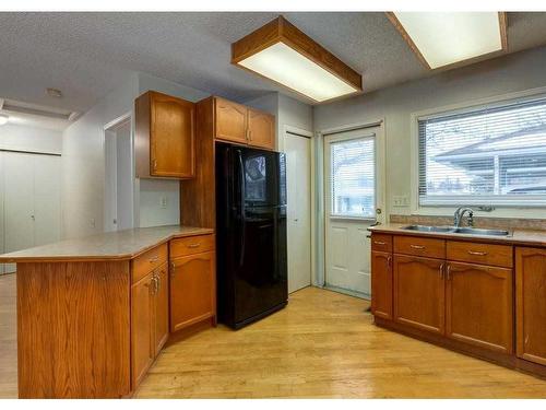 2828 Dovely Park Se, Calgary, AB - Indoor Photo Showing Kitchen With Double Sink