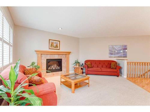 109 Panamount Road Nw, Calgary, AB - Indoor Photo Showing Living Room With Fireplace