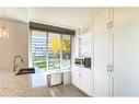 203-3204 Rideau Place Sw, Calgary, AB  - Indoor Photo Showing Kitchen With Double Sink 