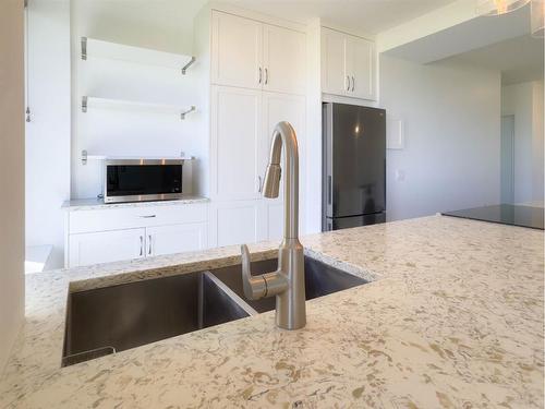 203-3204 Rideau Place Sw, Calgary, AB - Indoor Photo Showing Kitchen With Double Sink