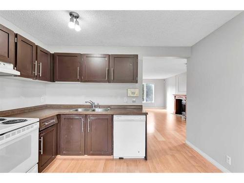 231 Sandstone Road Nw, Calgary, AB - Indoor Photo Showing Kitchen With Double Sink