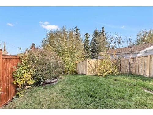 231 Sandstone Road Nw, Calgary, AB - Outdoor With Backyard